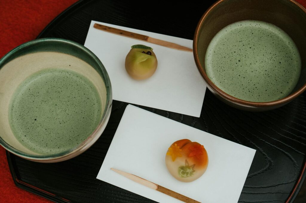 A simple onigiri rice ball on a white plate with chopsticks, the essential form of Japanese convenience food